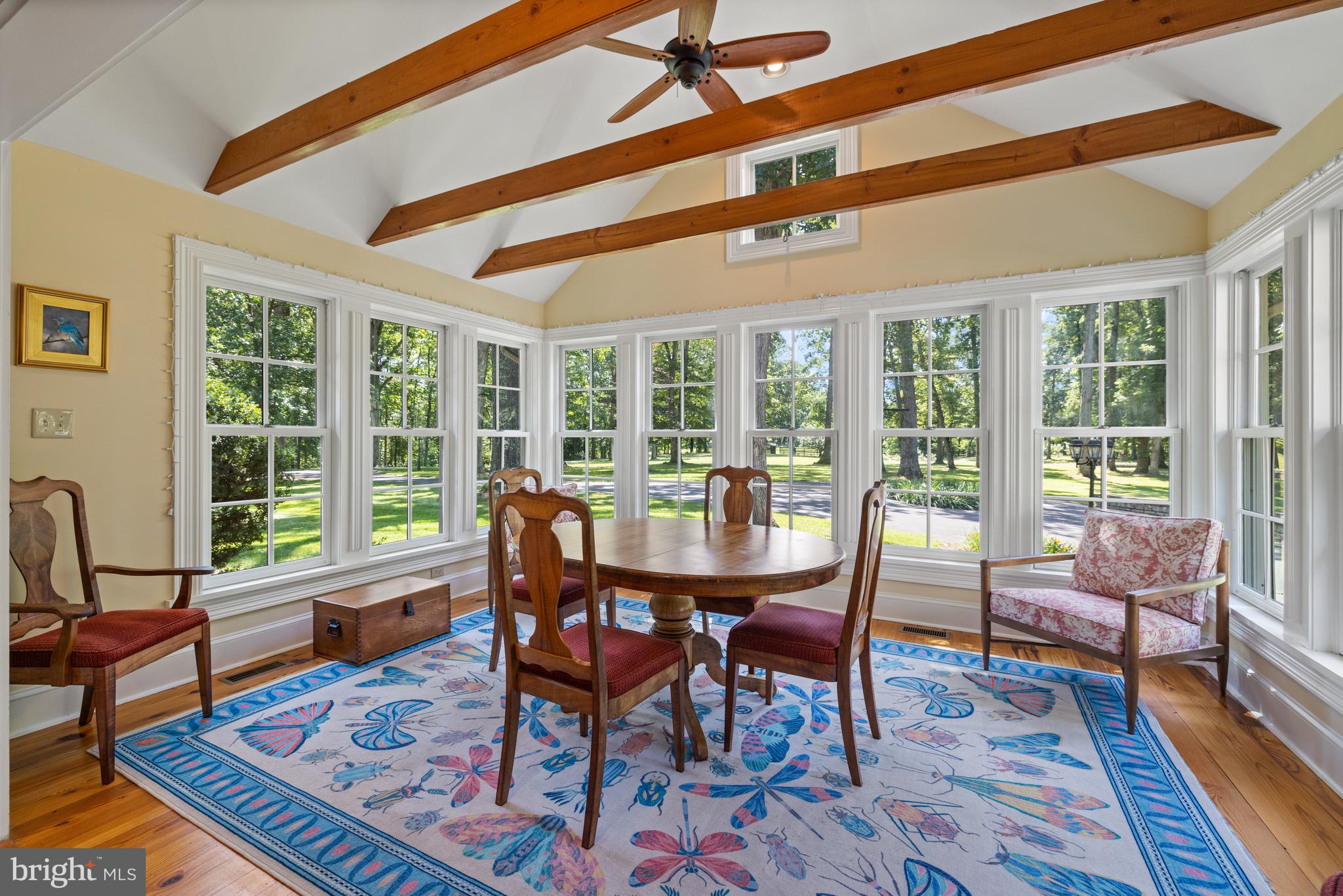 97 Tilthammer Mill Road Boyce, VA 22620 - Photo 19 of 68 a dining room with furniture wooden floor and a rug