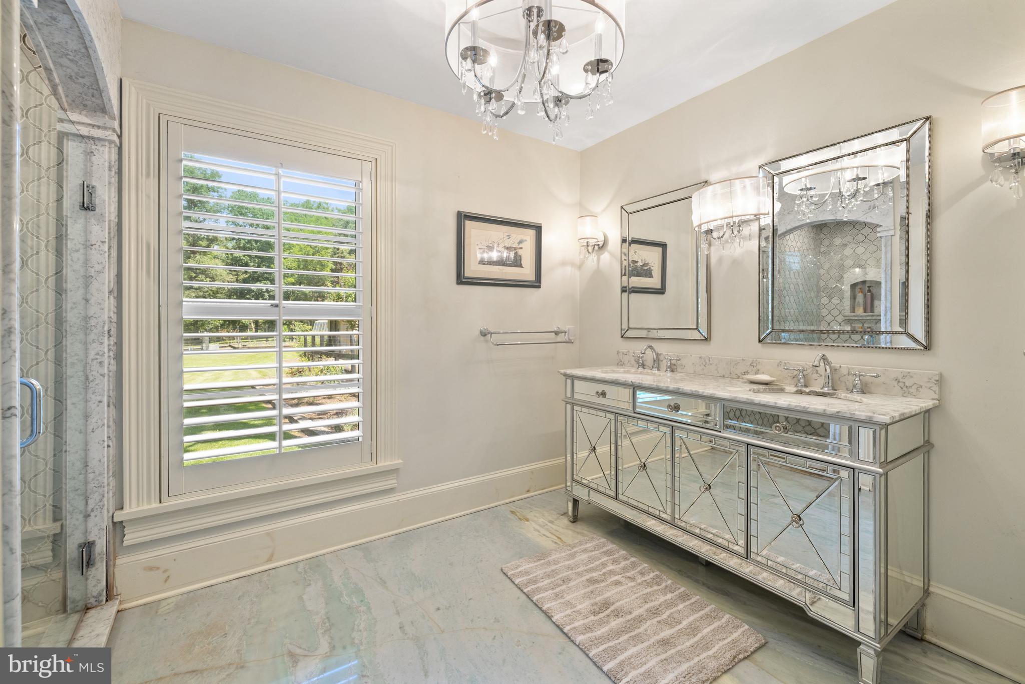 97 Tilthammer Mill Road Boyce, VA 22620 - Photo 24 of 68 a bathroom with a granite countertop sink a mirror and a window