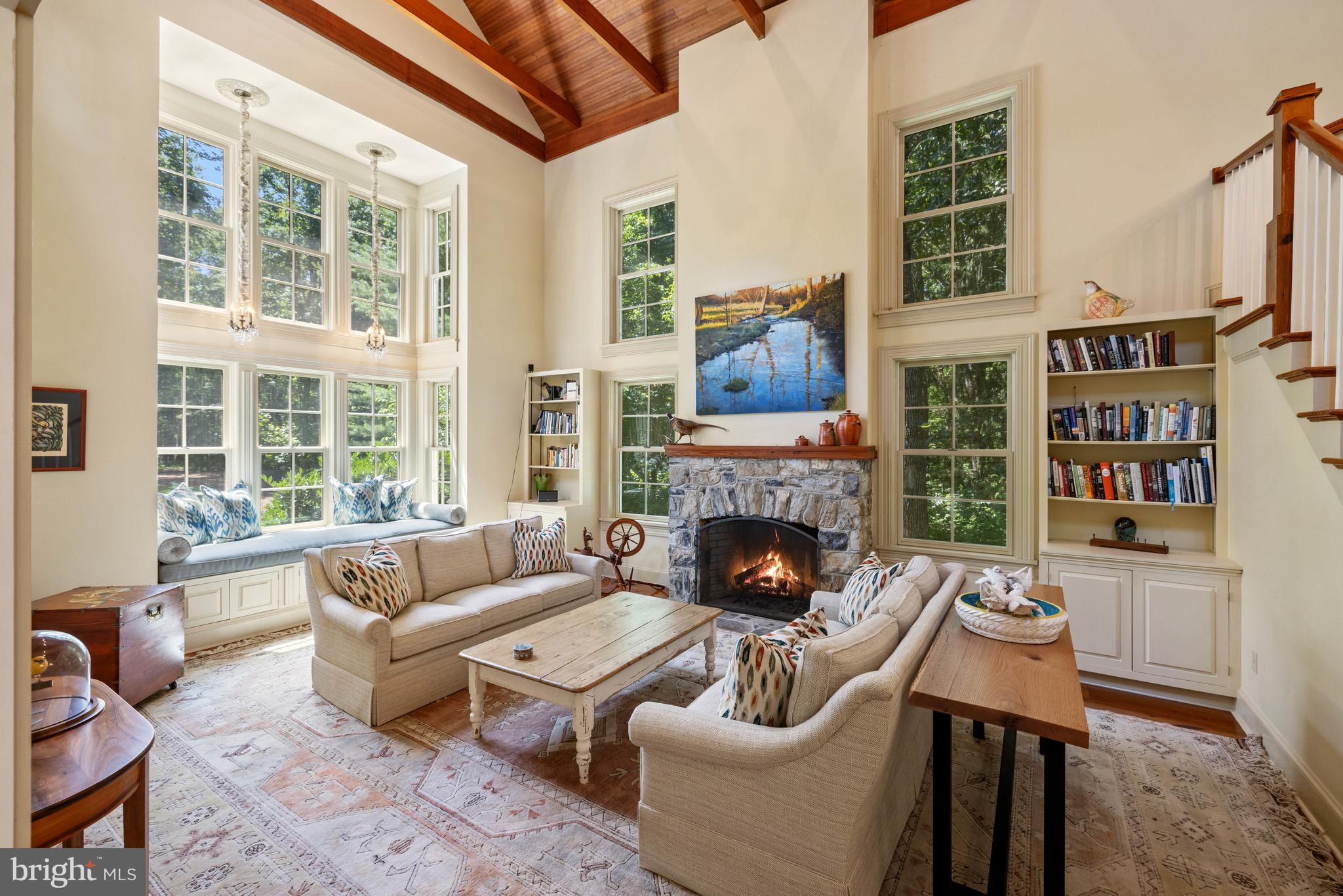 97 Tilthammer Mill Road Boyce, VA 22620 - Photo 7 of 68 a living room with furniture a fireplace and a large window
