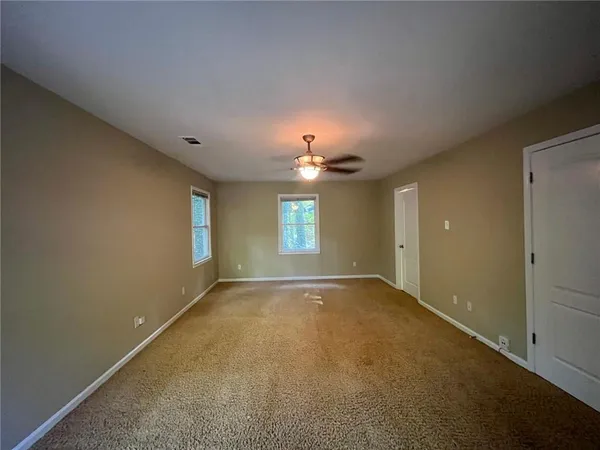 an empty room with a empty space and a window