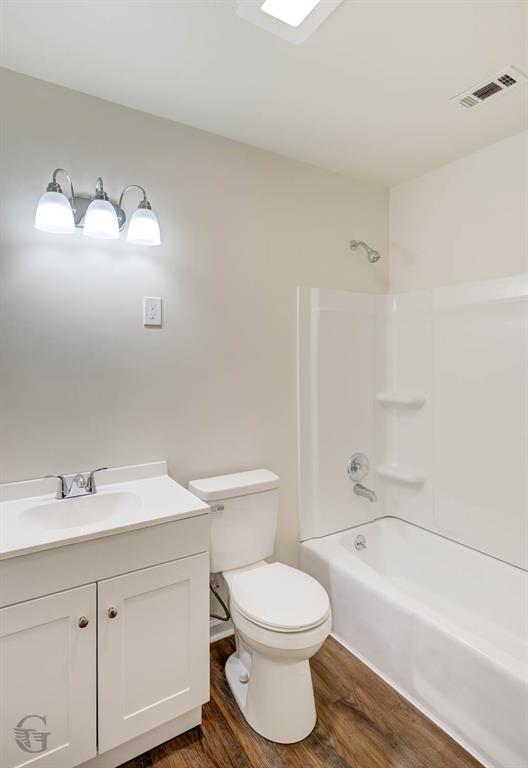 109 Milton Drive Minden, LA 71055 - Photo 15 of 24 a bathroom with a toilet a sink a mirror a bathtub and vanity
