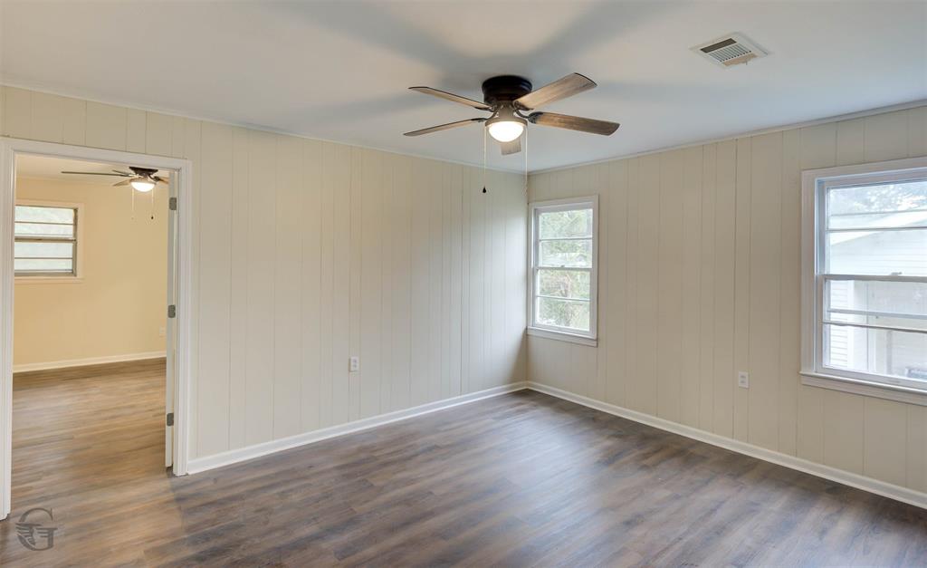 109 Milton Drive Minden, LA 71055 - Photo 16 of 24 a view of an empty room with wooden floor and a window
