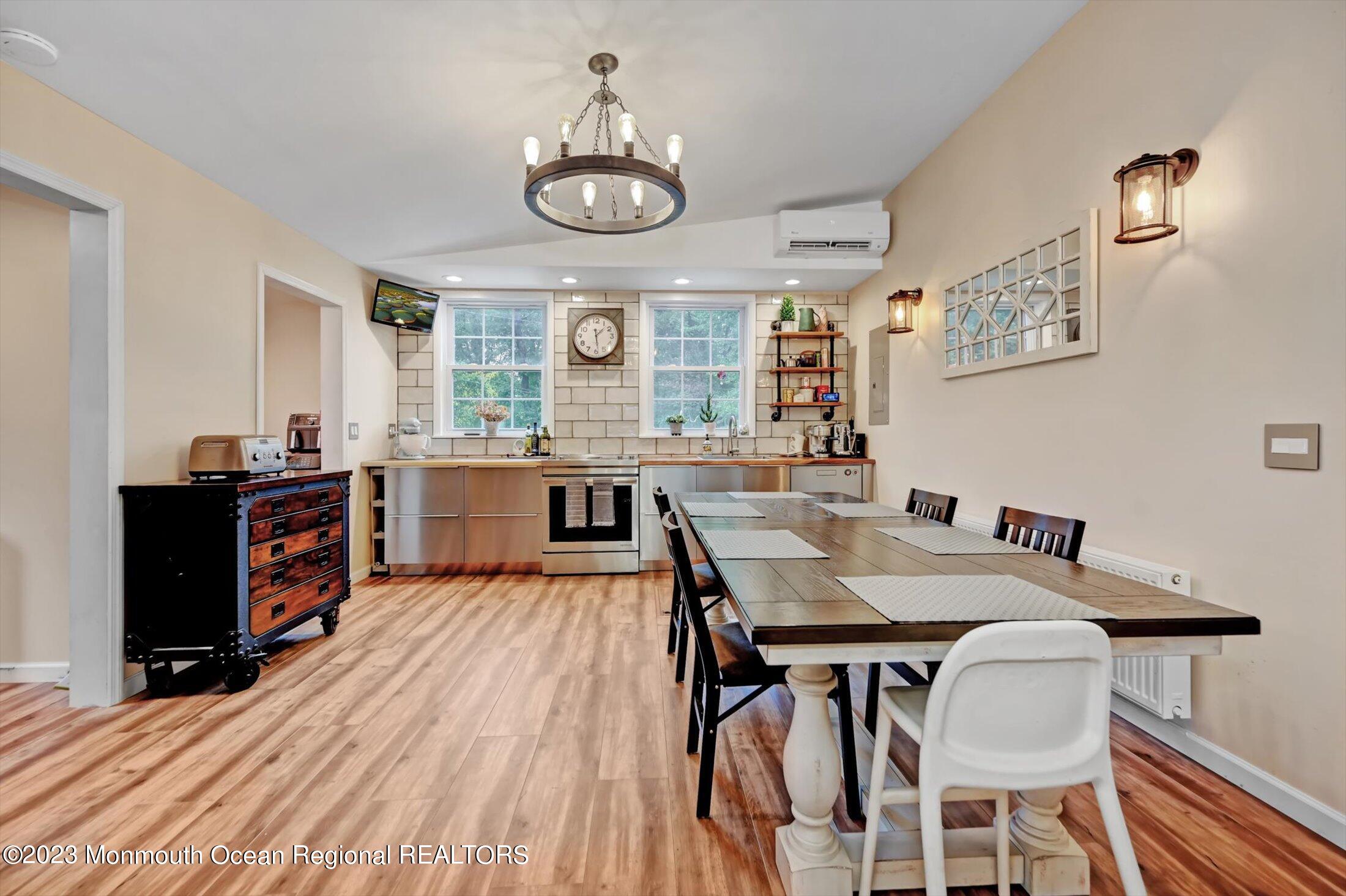 33 Conover Road Colts Neck, NJ 07722 - Photo 1 of 35 a view of a dining room with furniture and wooden floor
