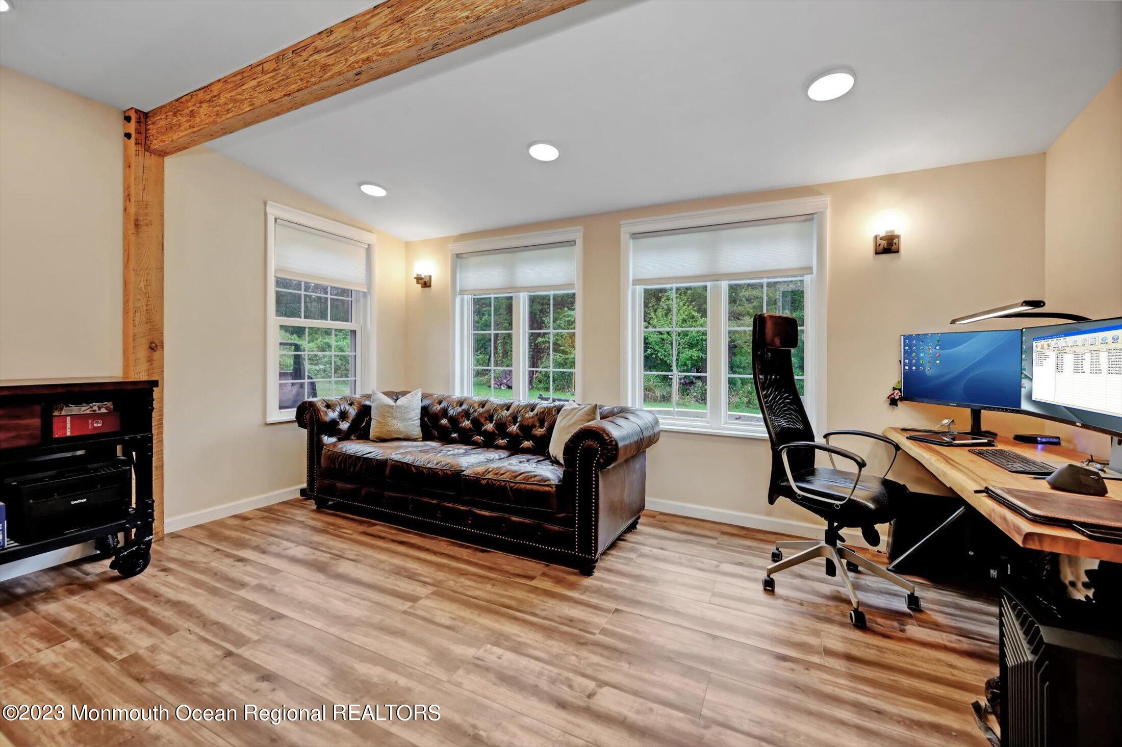 33 Conover Road Colts Neck, NJ 07722 - Photo 12 of 35 a living room with furniture and a flat screen tv