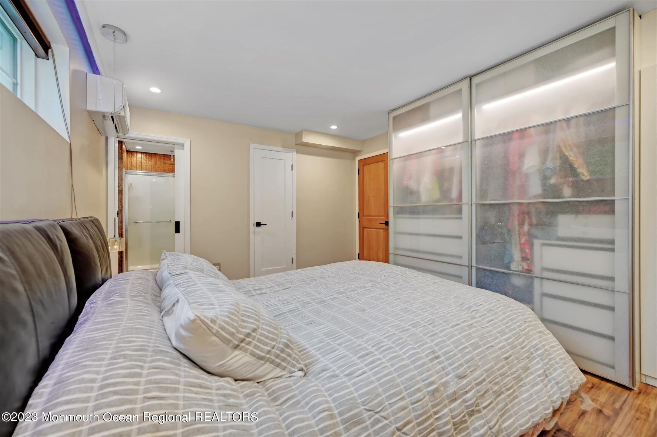 33 Conover Road Colts Neck, NJ 07722 - Photo 17 of 35 a bedroom with a bed and a closet