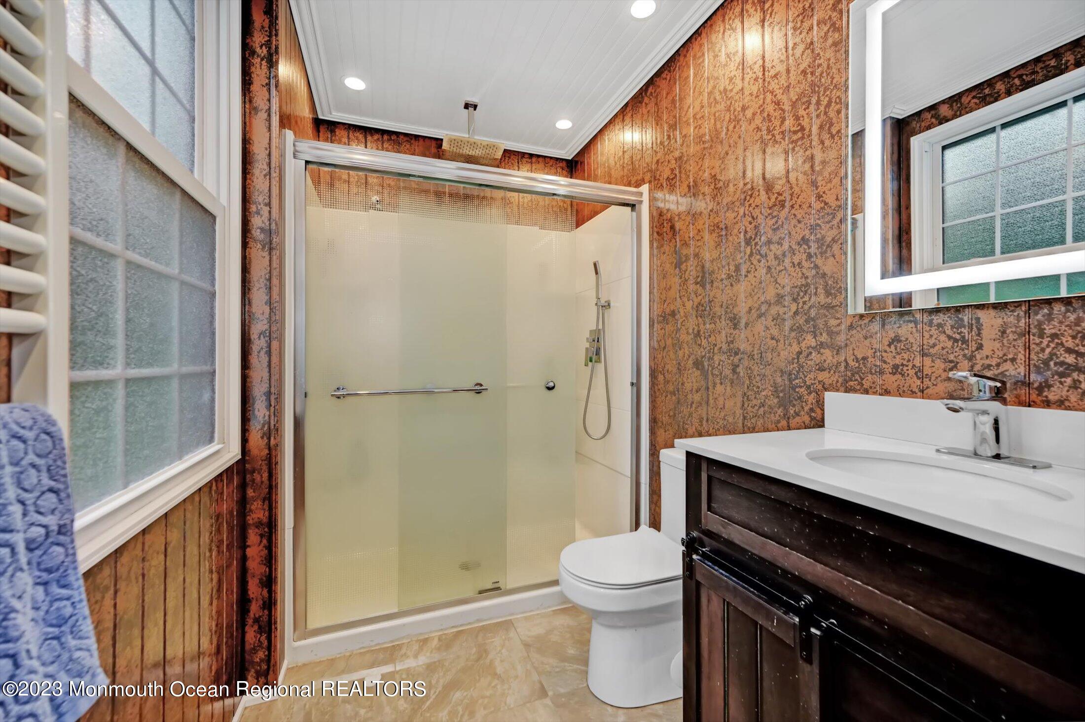 33 Conover Road Colts Neck, NJ 07722 - Photo 18 of 35 a bathroom with a sink a toilet a shower and a mirror