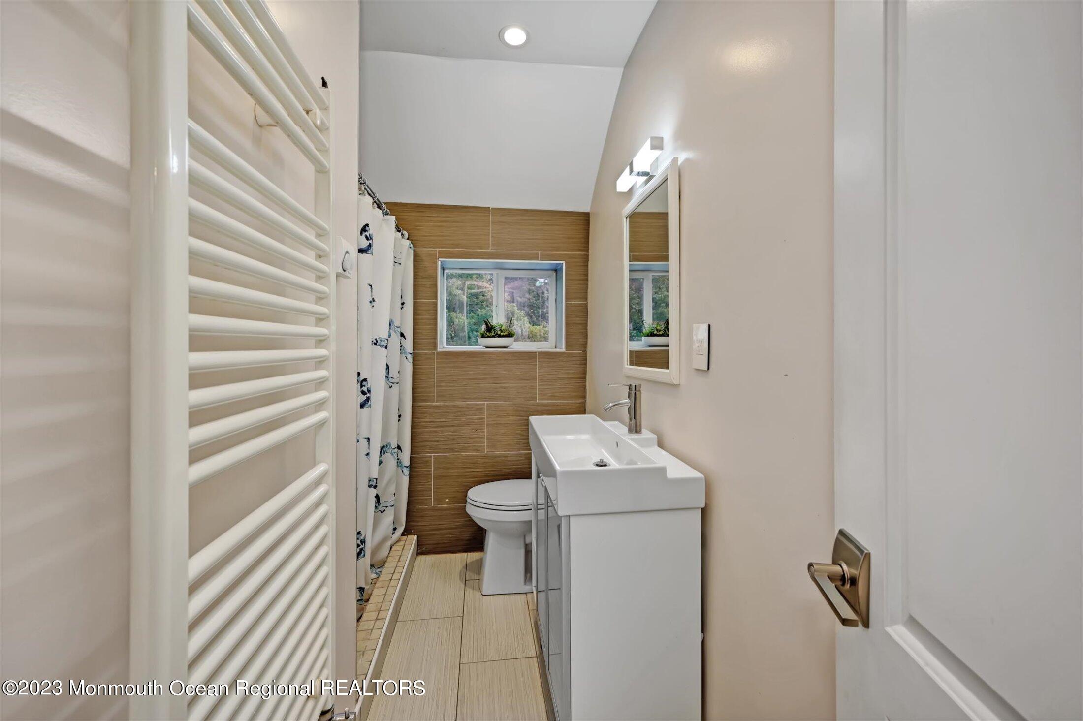 33 Conover Road Colts Neck, NJ 07722 - Photo 24 of 35 a bathroom with a sink toilet and shower