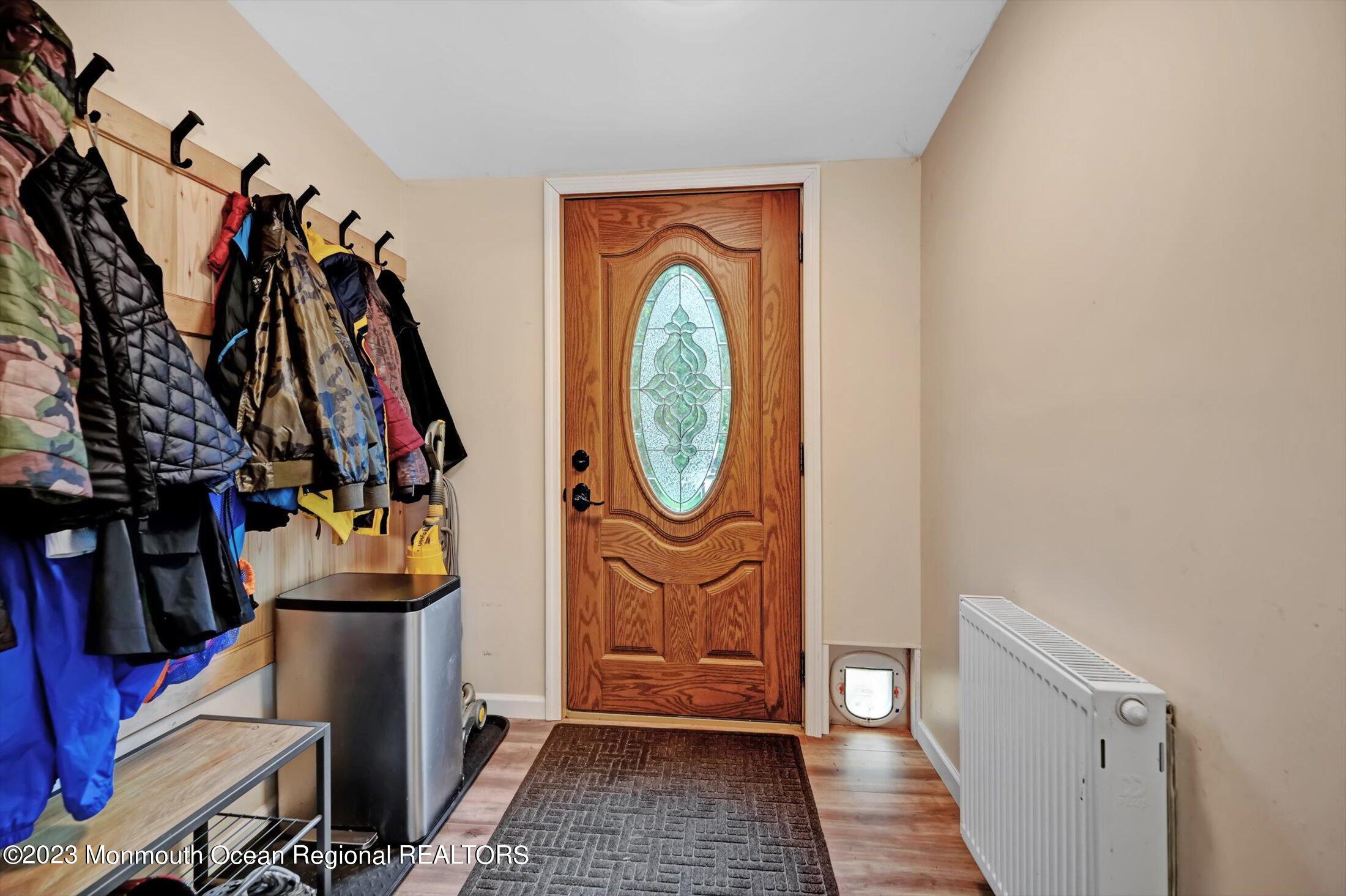 33 Conover Road Colts Neck, NJ 07722 - Photo 26 of 35 a view of an entryway with wooden floor