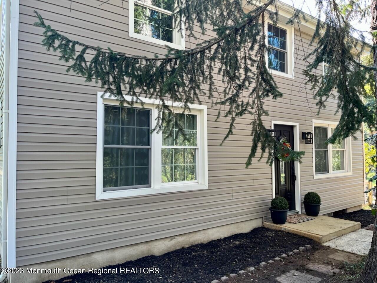 33 Conover Road Colts Neck, NJ 07722 - Photo 3 of 35 a view of a house with a yard and sitting area