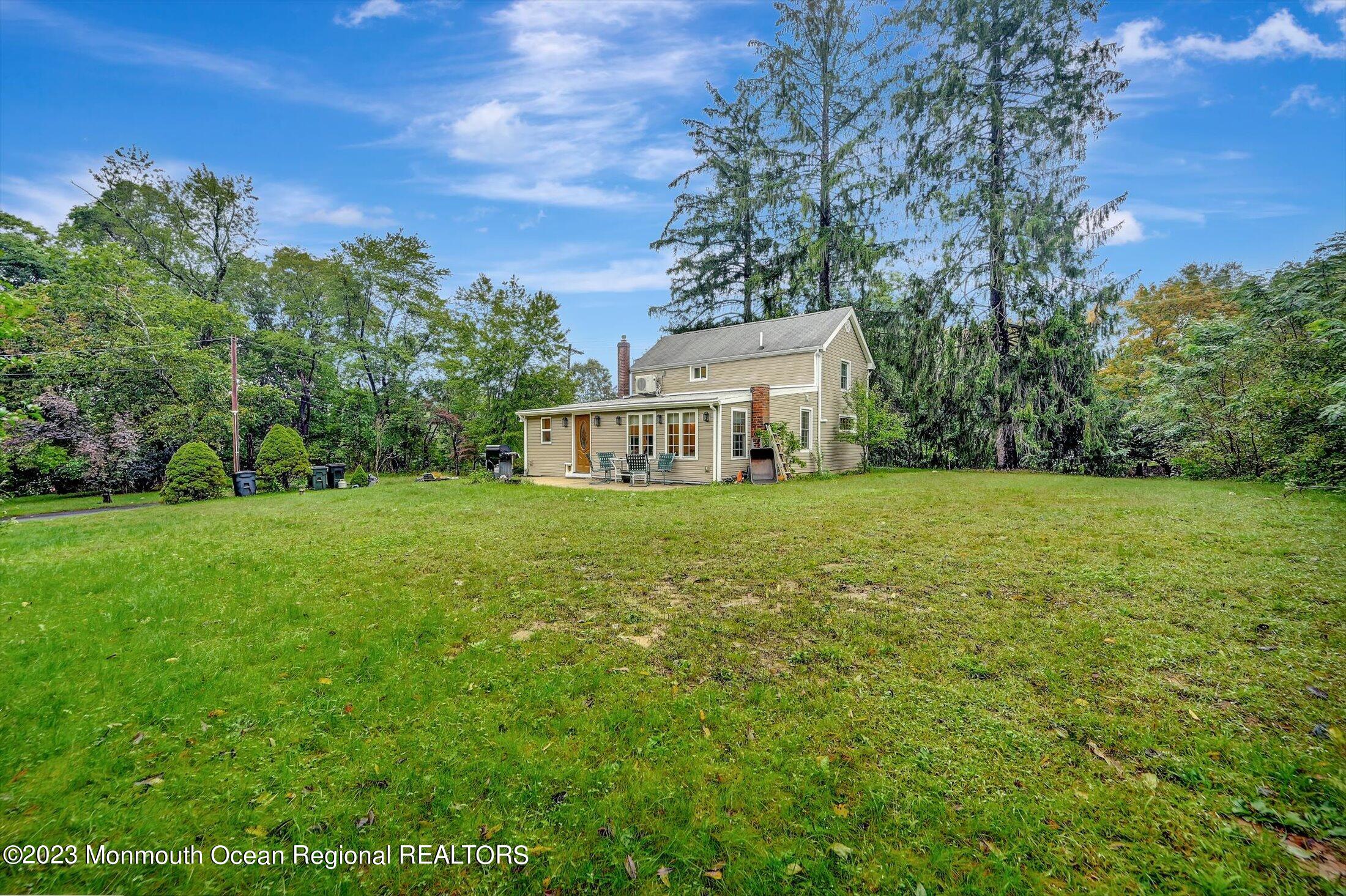 33 Conover Road Colts Neck, NJ 07722 - Photo 31 of 35 a view of a house with yard and tree s