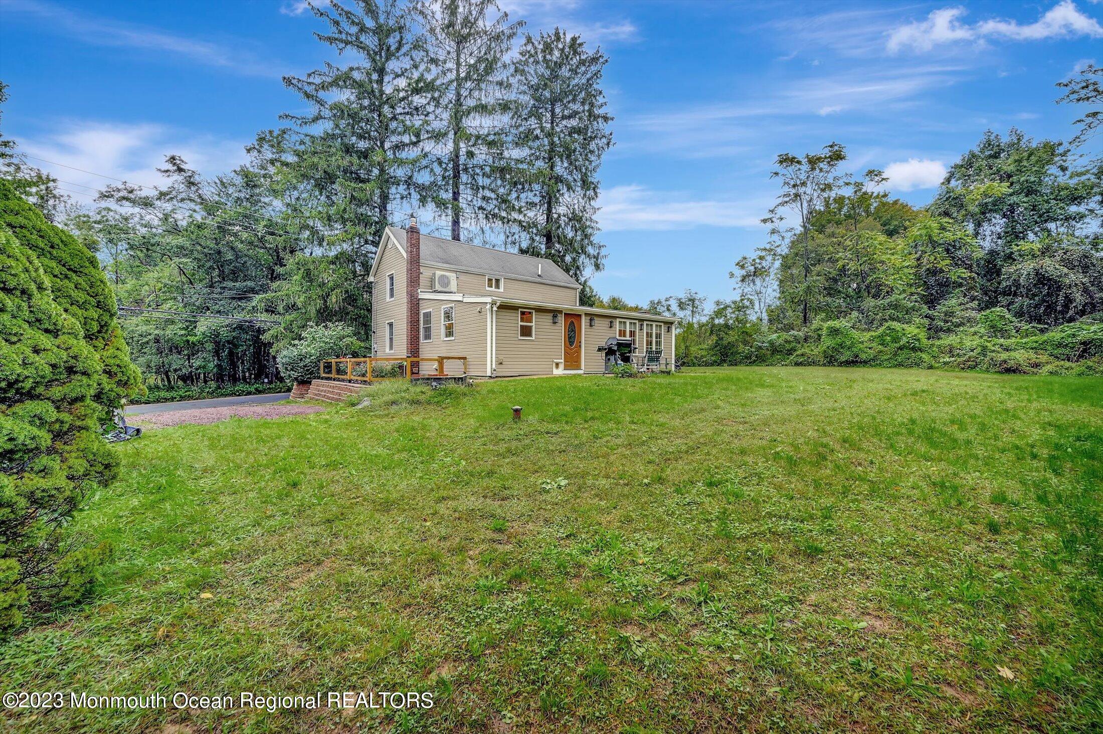 33 Conover Road Colts Neck, NJ 07722 - Photo 32 of 35 a view of a house with a big yard