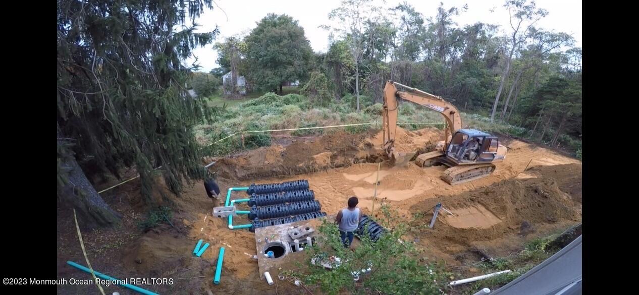 33 Conover Road Colts Neck, NJ 07722 - Photo 34 of 35 a backyard of a house with outdoor seating