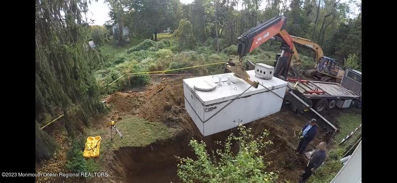 33 Conover Road Colts Neck, NJ 07722 - Photo 35 of 35 a view of a house with a yard and sitting area
