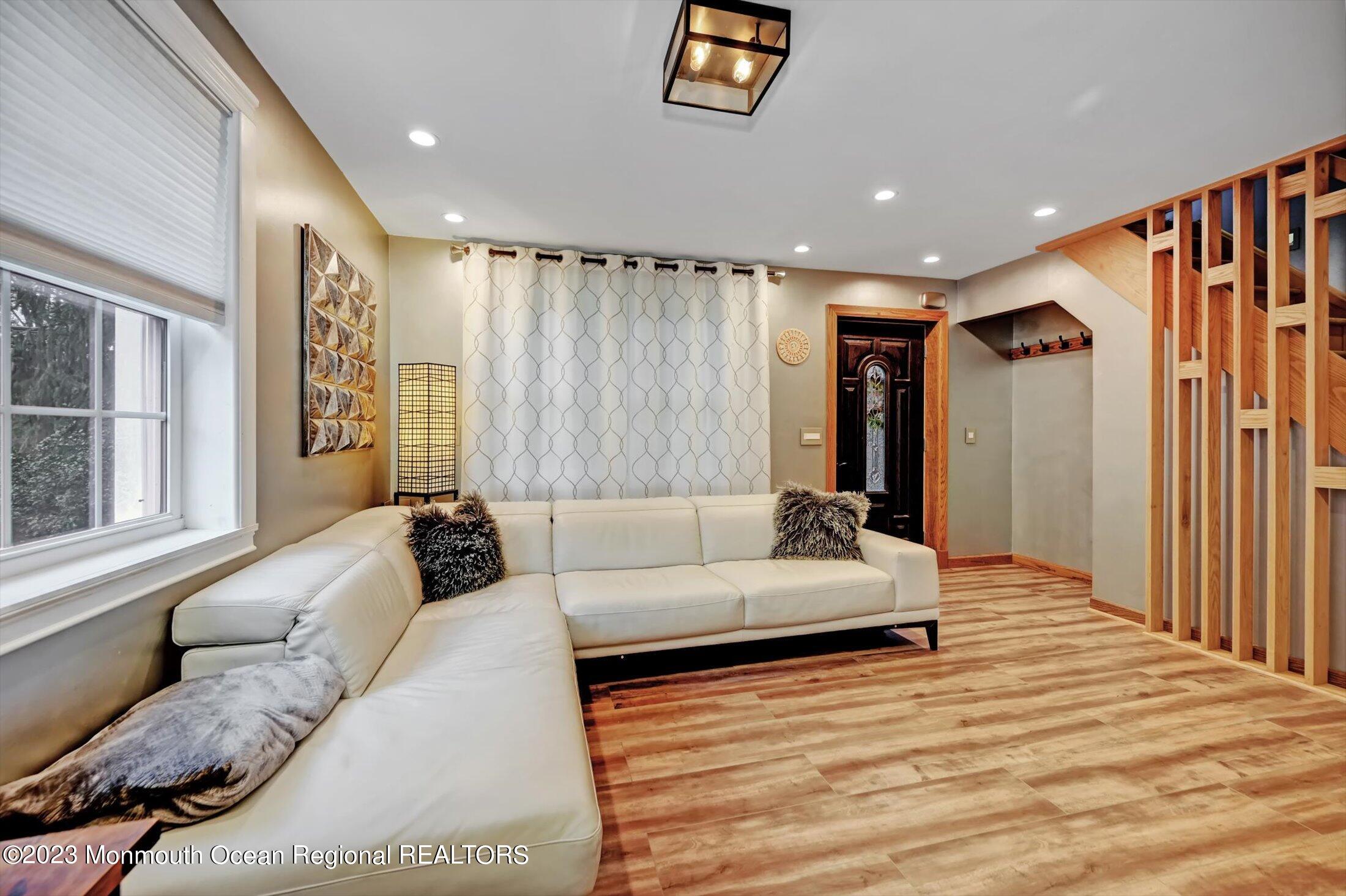 33 Conover Road Colts Neck, NJ 07722 - Photo 5 of 35 a living room with furniture and a window