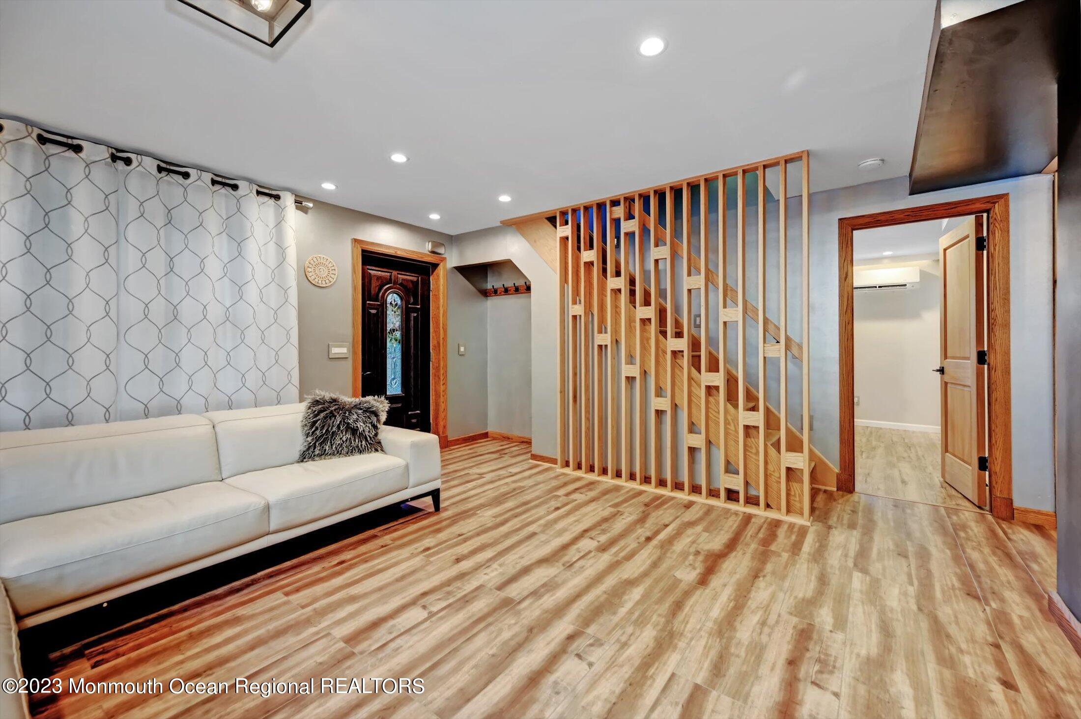 33 Conover Road Colts Neck, NJ 07722 - Photo 7 of 35 a spacious bedroom with a bed and a couch