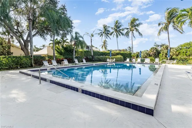 an aerial view of a house with garden space and lake view