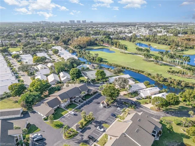 an aerial view of a city and lake view