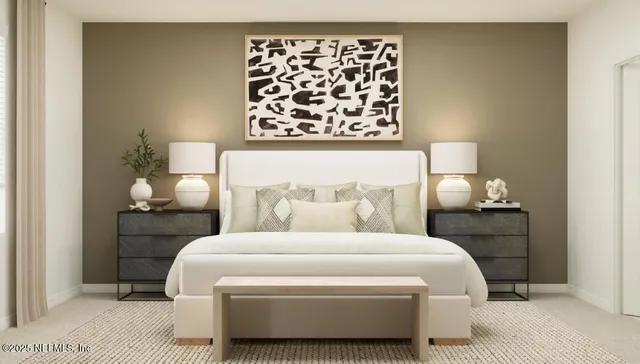 a bedroom with a bed and a lamp