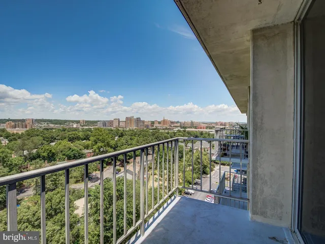 a view of a balcony with furniture