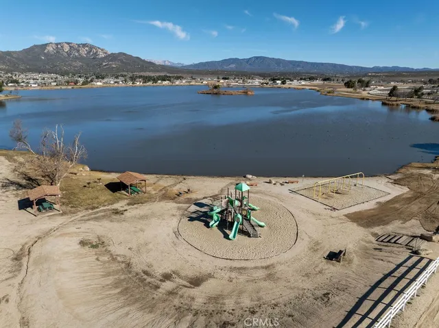 an aerial view of a house with a lake view