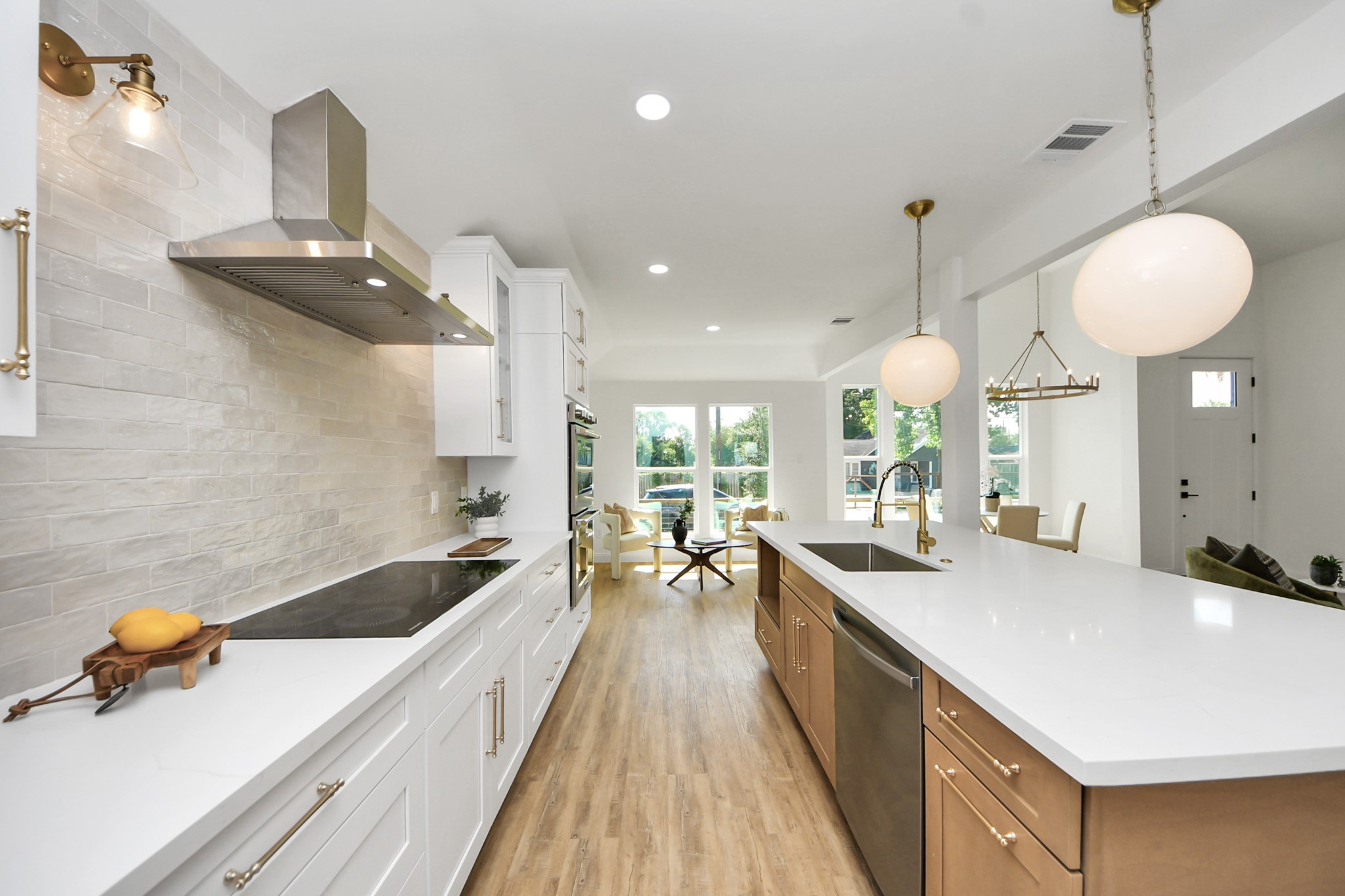 1737 Tabor Street Houston, TX 77009 - Photo 18 of 44 a large kitchen with kitchen island a large counter space a sink a window and stainless steel appliances