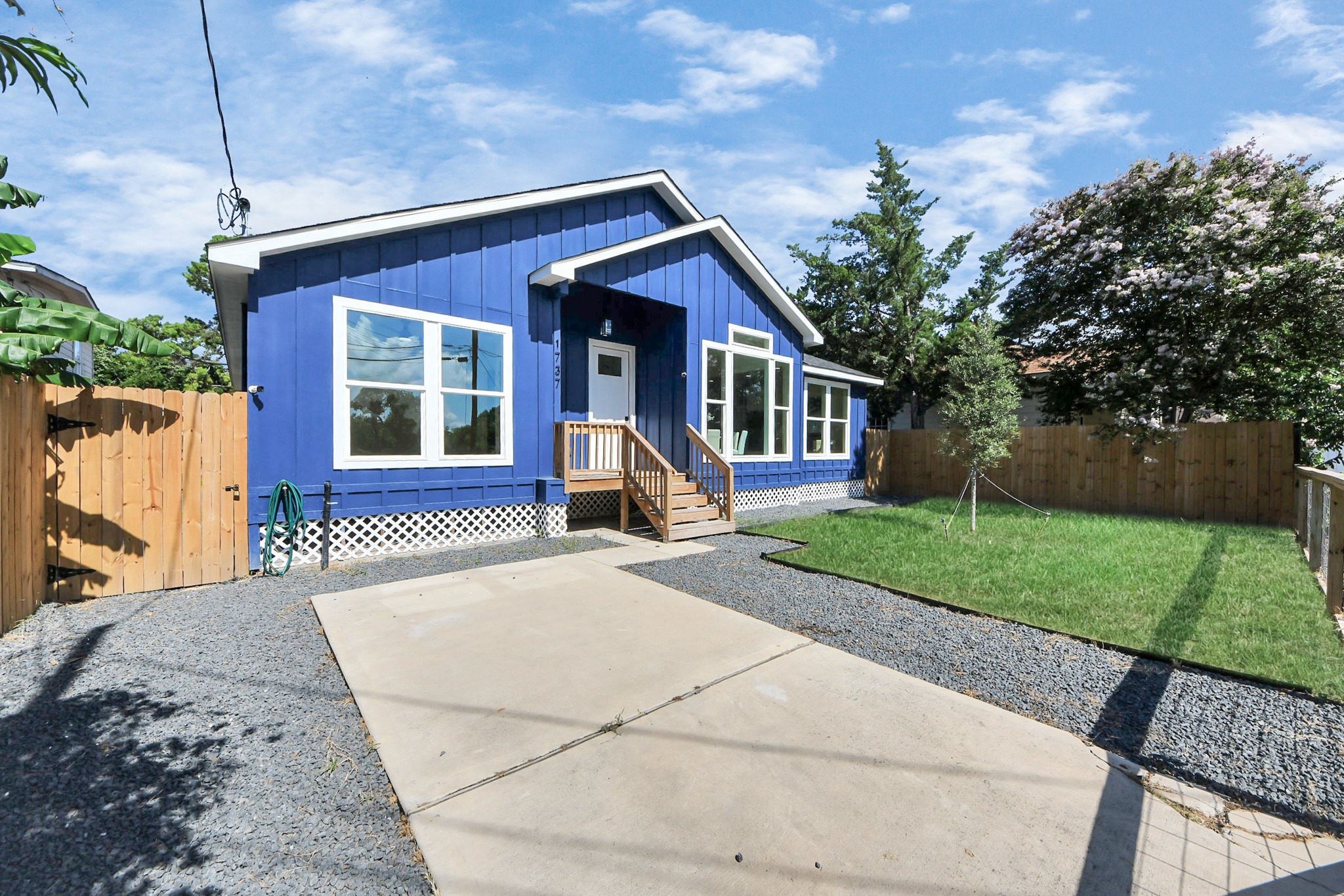 1737 Tabor Street Houston, TX 77009 - Photo 40 of 44 a front view of a house with a yard and potted plants