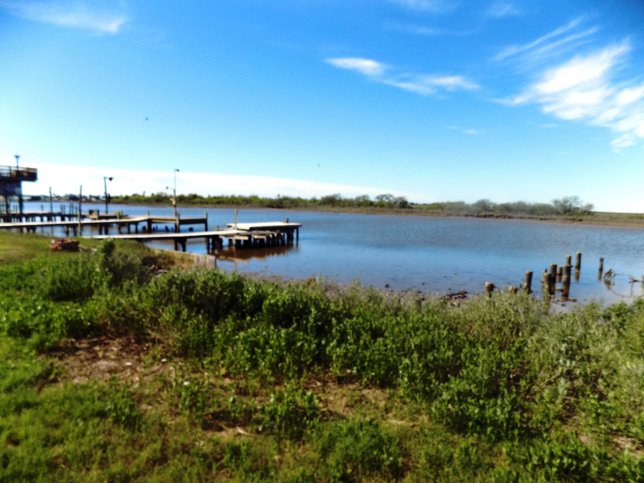 616 Seagull Road Sargent, TX 77414 - Photo 2 of 7 a view of a lake with houses in the back