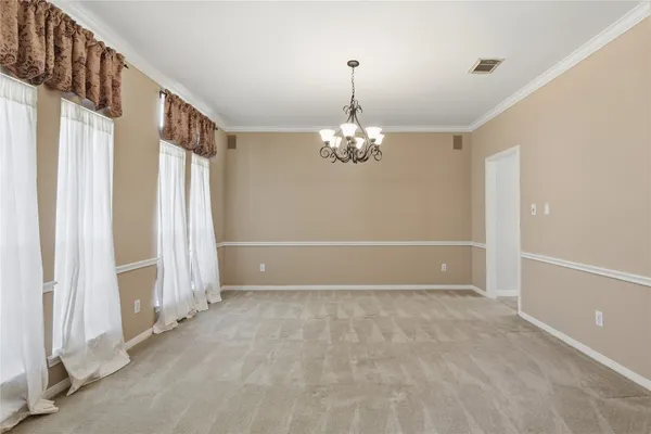 a kitchen with kitchen island granite countertop stainless steel appliances a sink stove and refrigerator