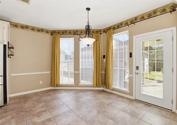 a view of a kitchen with a sink and cabinets