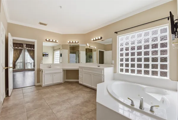 a bathroom with a tub and a shower
