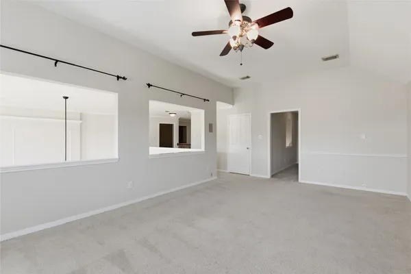 a view of an empty room with a window