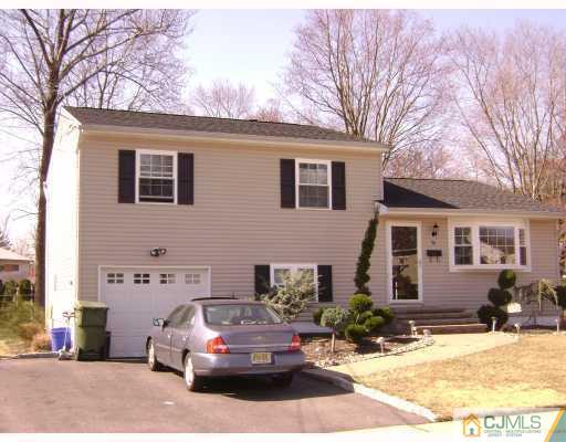 34 Baldwin Road Edison, NJ 08817 - Photo 1 of 8 a car parked in front of a house