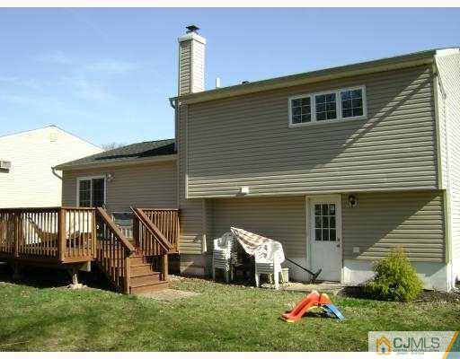 34 Baldwin Road Edison, NJ 08817 - Photo 6 of 8 a front view of a house with a yard and staircase