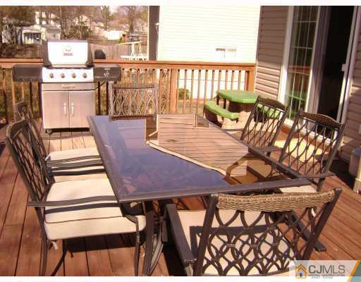 34 Baldwin Road Edison, NJ 08817 - Photo 7 of 8 a view of a chairs and table in the balcony