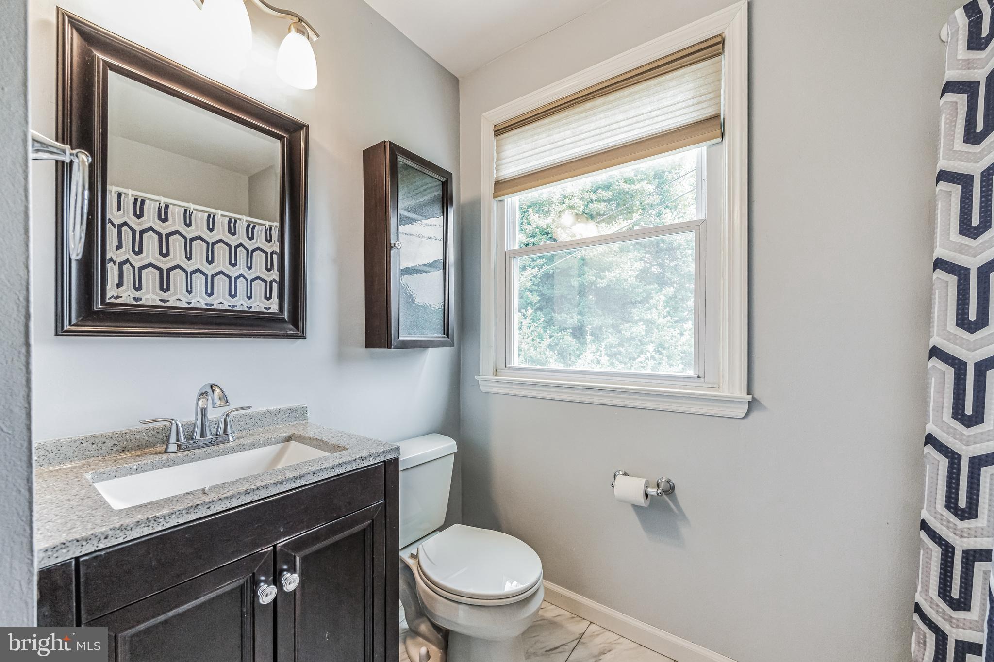 709 Windsor Place Wallingford, PA 19086 - Photo 27 of 35 Updated full hall bath