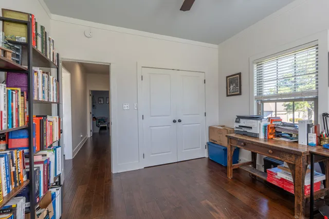 a room with lots of furniture and baby crib