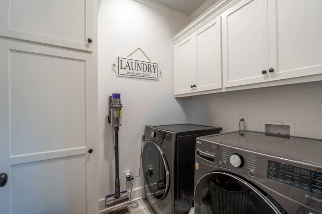 a utility room with dryer and washer