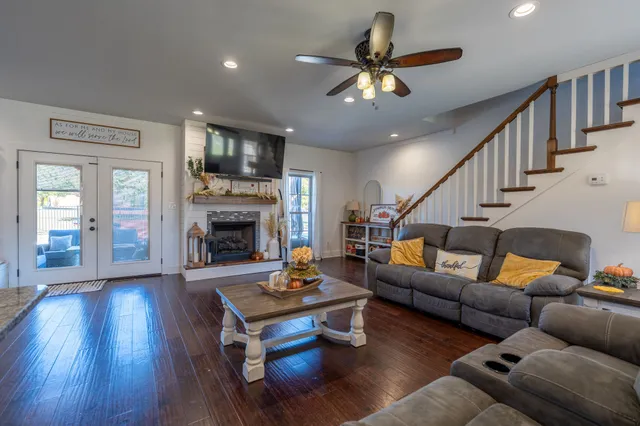 a living room with furniture fireplace and a flat screen tv