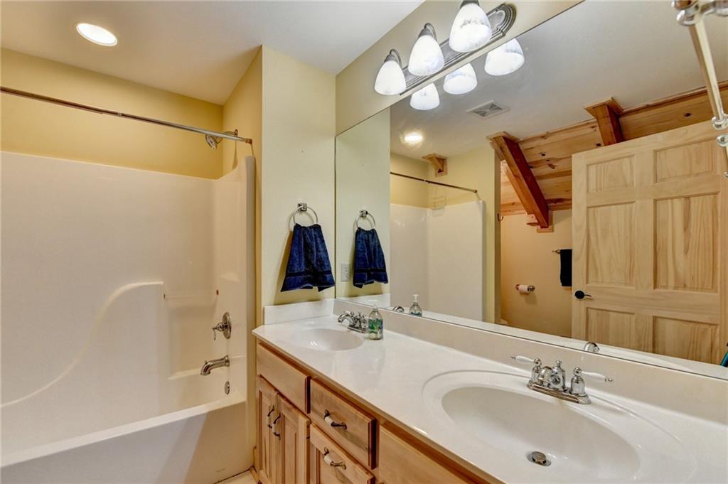 82 Walnut Grove Lane Tiger, GA 30576 - Photo 51 of 88 a bathroom with a tub sink and mirror