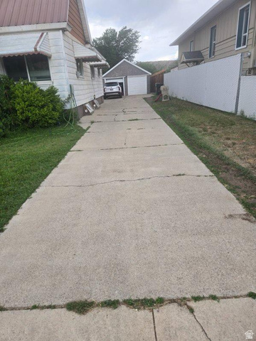 27 Bryner Street Helper, UT 84526 - Photo 10 of 10 Long concrete driveway providing access to a detached two-car garage