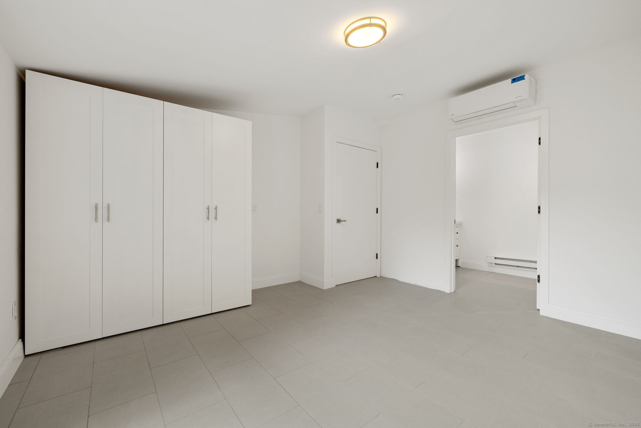 529 Danbury Road, Unit C Wilton, CT 06897 - Photo 13 of 21 an empty room with closet area