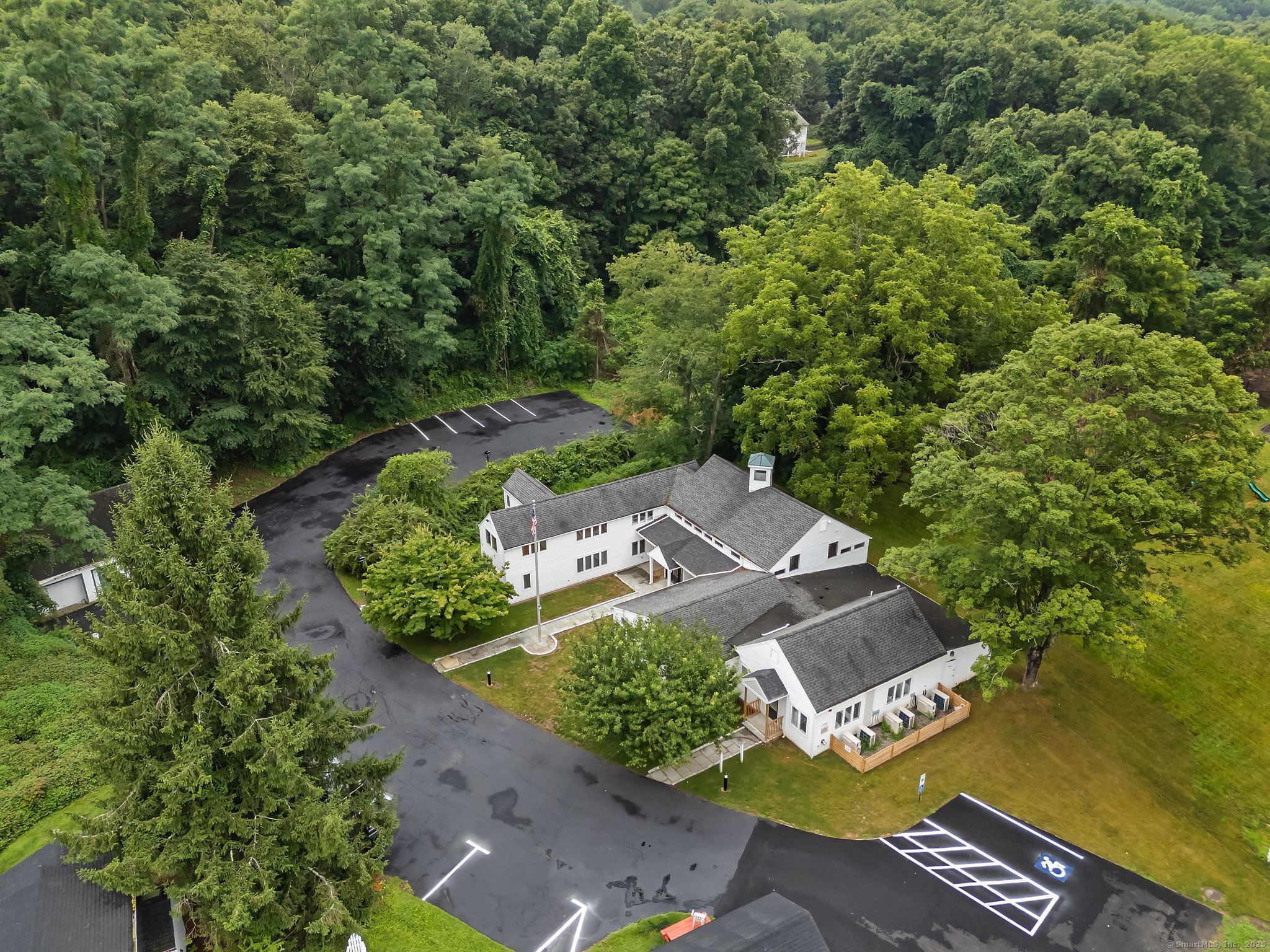 529 Danbury Road, Unit C Wilton, CT 06897 - Photo 18 of 21 an aerial view of a house with a yard