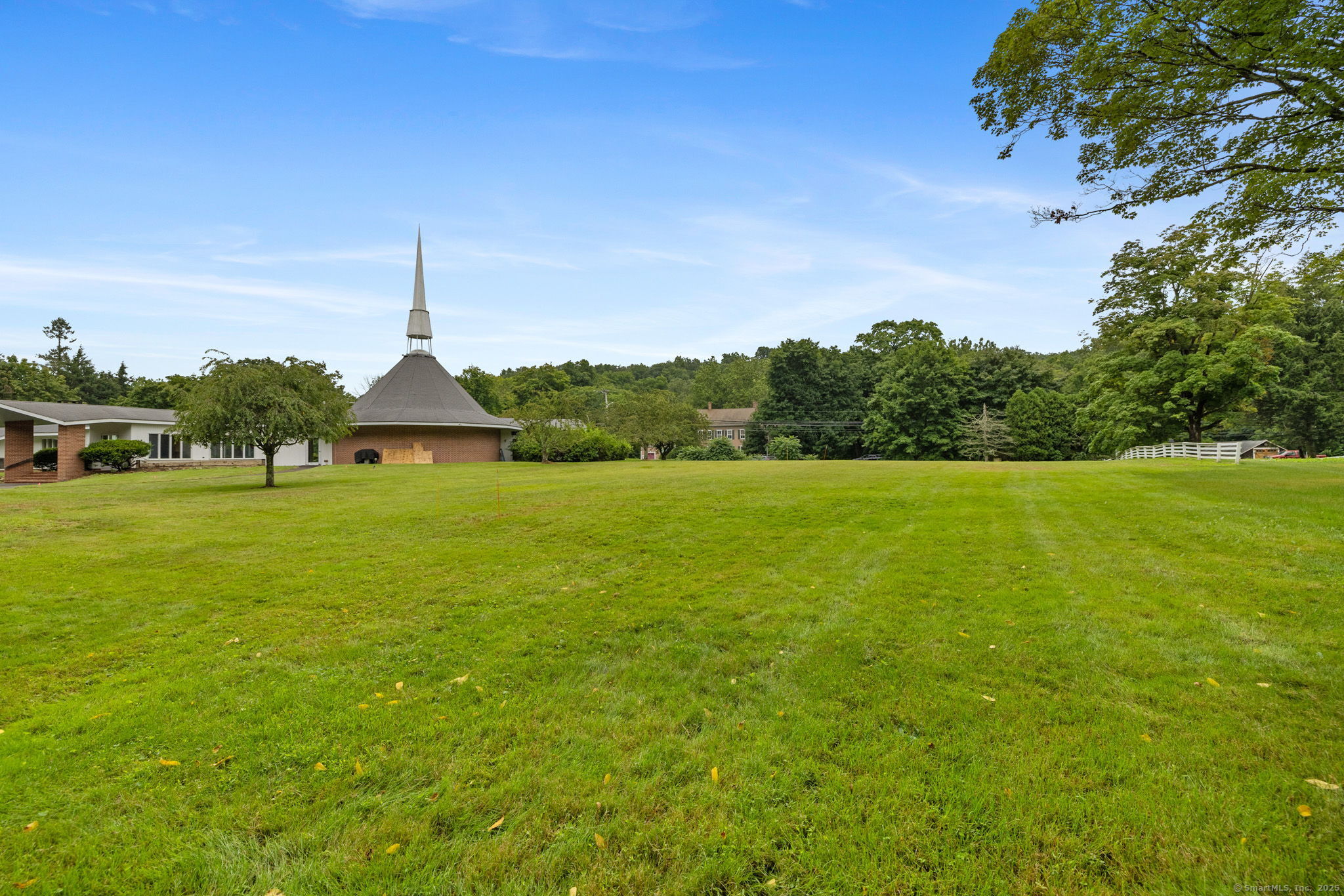 529 Danbury Road, Unit C Wilton, CT 06897 - Photo 19 of 21 a view of a lake with a big yard