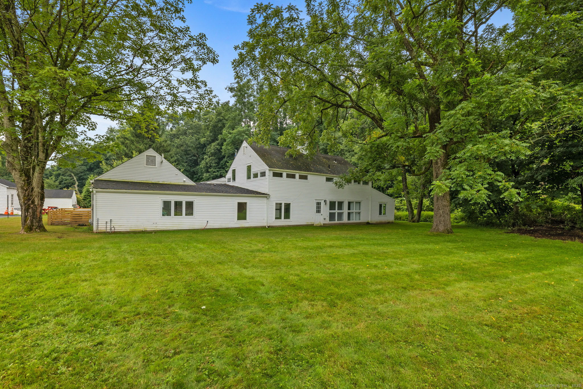 529 Danbury Road, Unit C Wilton, CT 06897 - Photo 20 of 21 a view of a yard in front of a house