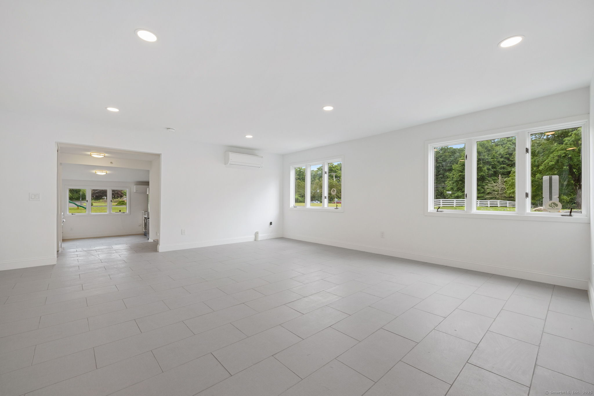 529 Danbury Road, Unit C Wilton, CT 06897 - Photo 9 of 21 an empty room with windows