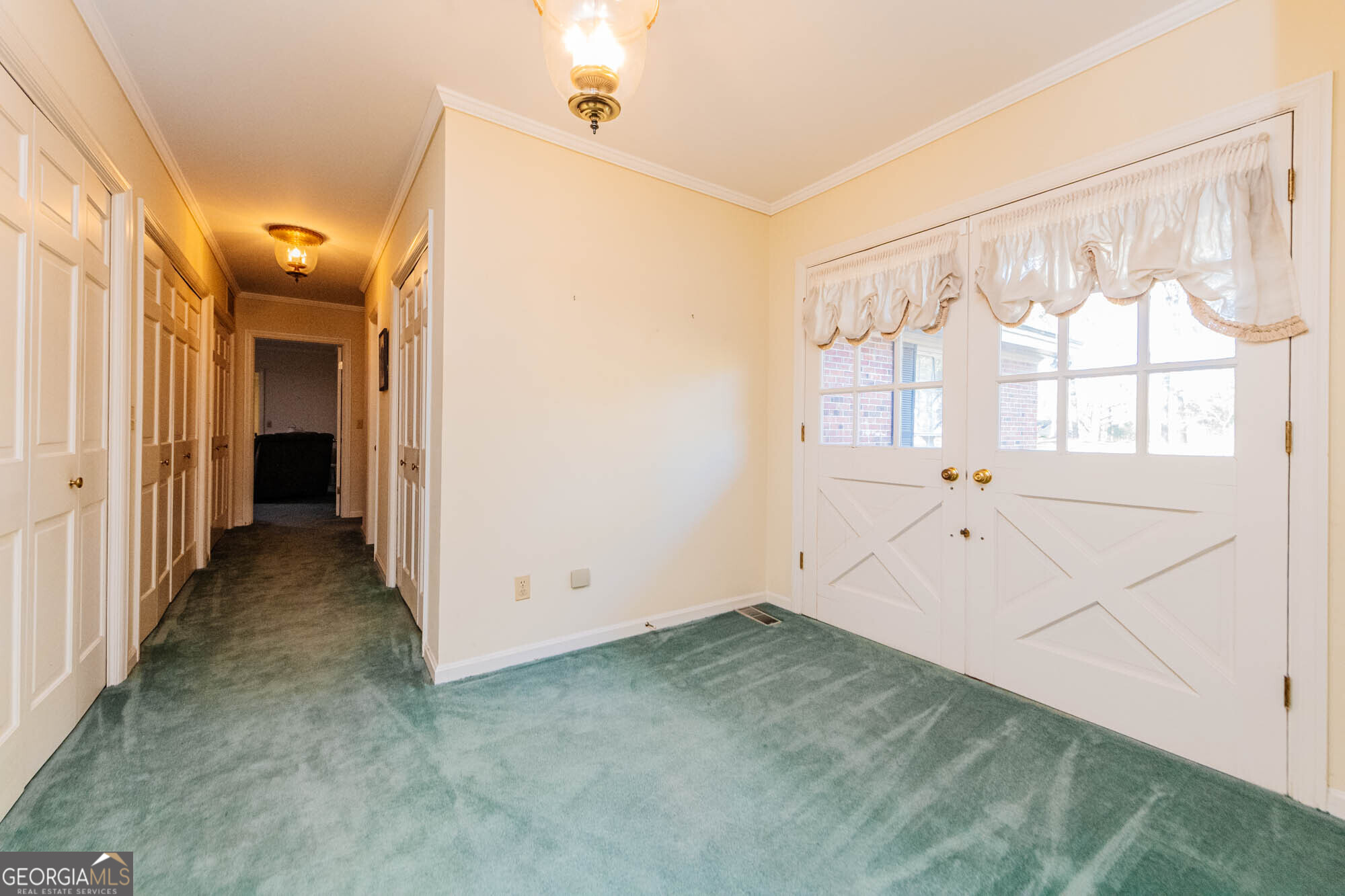5207 Forest Lake Road Eastman, GA 31023 - Photo 16 of 56 a view of a big room with wooden floor and windows