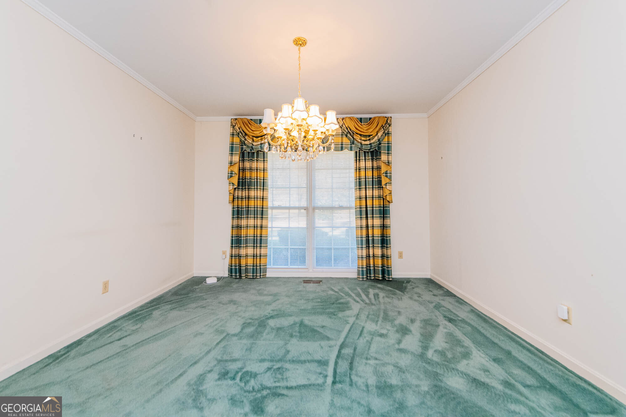 5207 Forest Lake Road Eastman, GA 31023 - Photo 18 of 56 a view of a big room with windows and chandelier fan