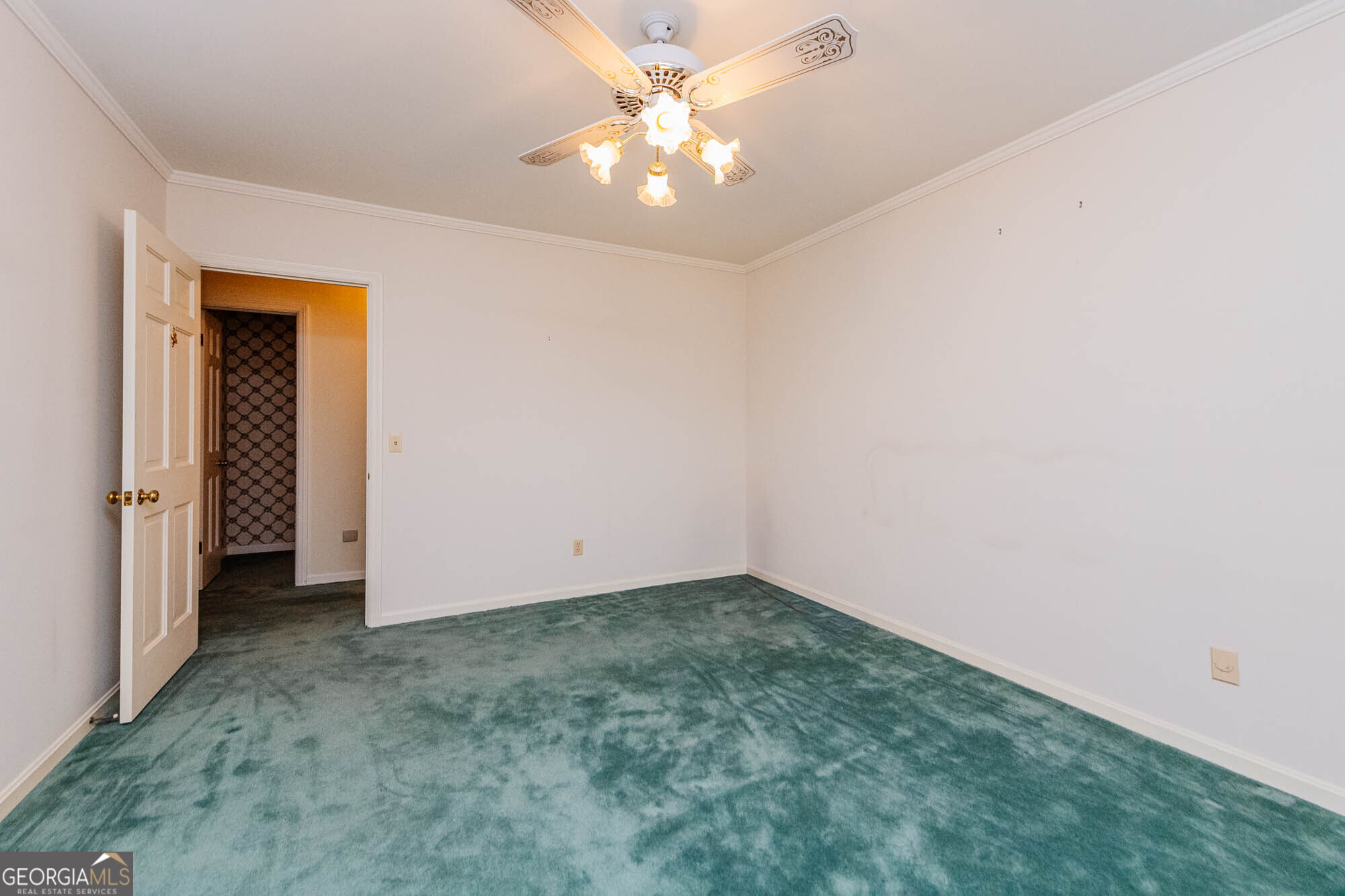 5207 Forest Lake Road Eastman, GA 31023 - Photo 38 of 56 an empty room with a chandelier fan and closet