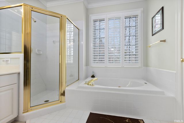 a white bath tub sitting next to a window