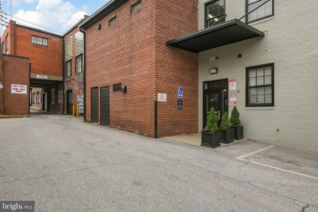 a view of a porch with wooden floor and stairs
